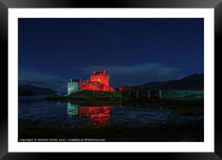 Eilean Donan Castle floodlit for remembrance day. Framed Mounted Print by Richard Smith