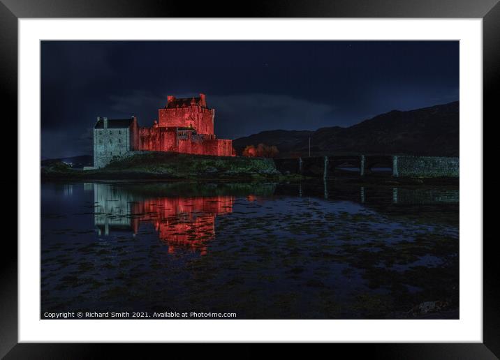 Red and white floodlighting of Eilean Donan Castle for Remembrance Sunday Framed Mounted Print by Richard Smith