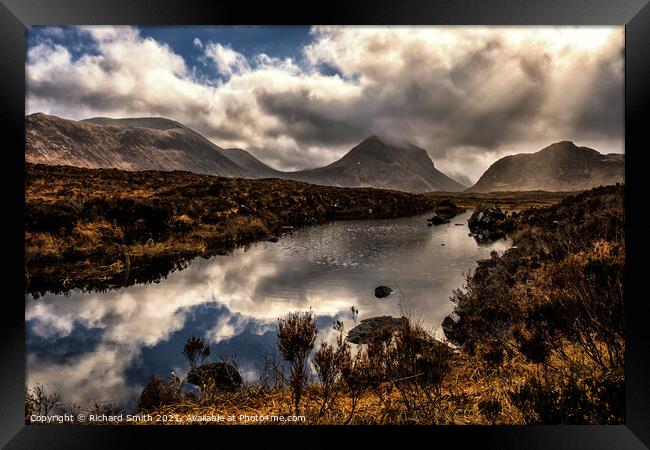 Reflections in a mountain loch, Marsco in the distance. Framed Print by Richard Smith