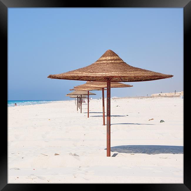 Sun Shades on the beach Framed Print by Ahmed Shaker