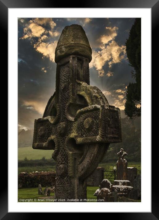Celtic cross sunlight Framed Mounted Print by Brian O'Dwyer