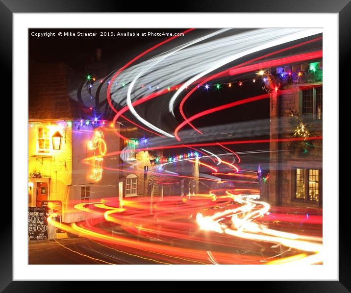 Christmas light trails Framed Mounted Print by Mike Streeter