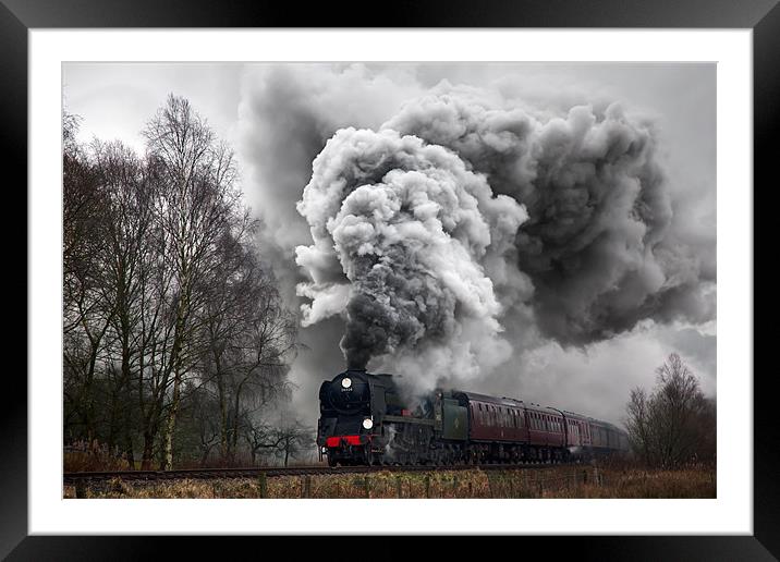 A historic steam locomotive produces volcanic exha Framed Mounted Print by Ian Duffield
