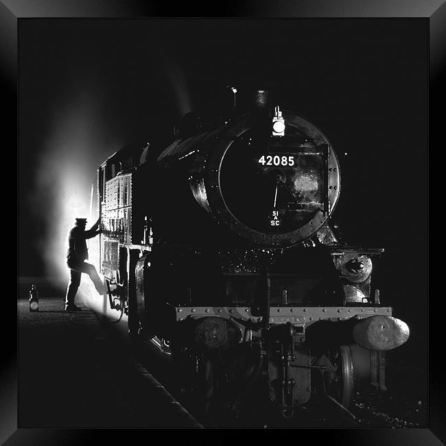 Steam loco fireman climbing aboard Framed Print by Ian Duffield