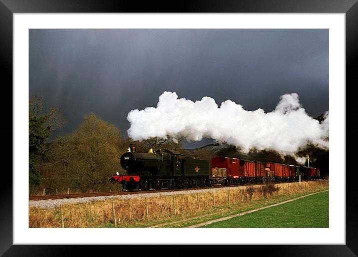 Goods train running ahead of a snowstorm  Framed Mounted Print by Ian Duffield