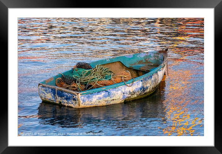 Enduring Beauty of a weather-worn boat Framed Mounted Print by Roger Dutton