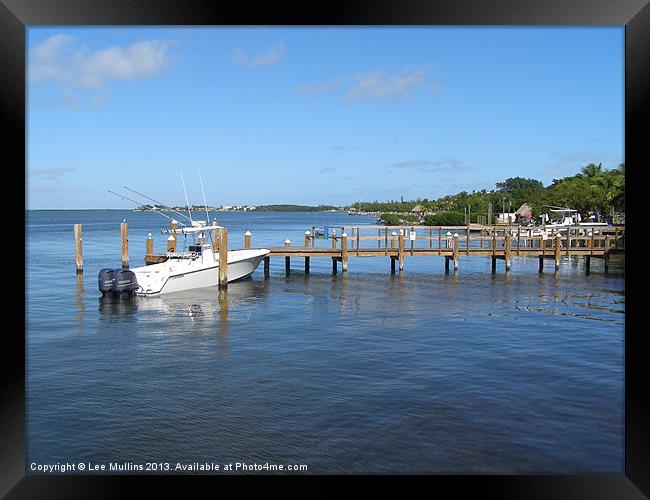 Boat at the jetty Framed Print by Lee Mullins