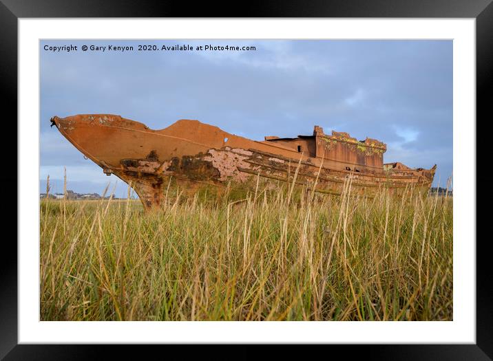 Old Rusty boat through the grasses at Fleetwood Framed Mounted Print by Gary Kenyon
