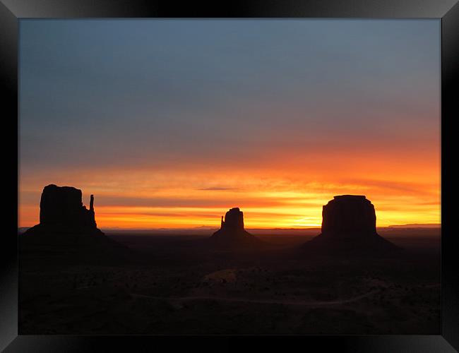 Sunrise at Monument Valley Framed Print by Lois Eley