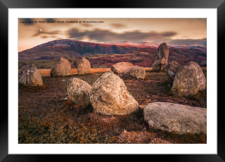Castlerigg is perhaps the most atmospheric and dramatically sited of all British stone circles, with panoramic views and the mountains of Helvellyn and High Seat  Framed Mounted Print by Peter Stuart