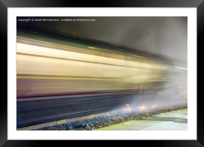 Steam train at speed at night. Framed Mounted Print by David Birchall