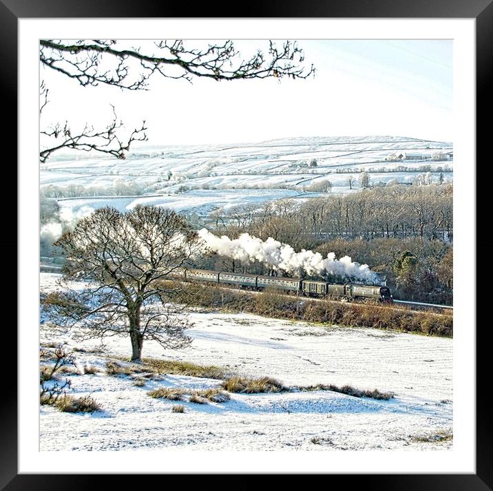 Steam train in a snowy landscape. Framed Mounted Print by David Birchall