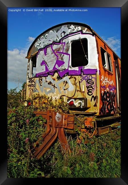 Abandoned railway carriage covered in graffiti. Framed Print by David Birchall