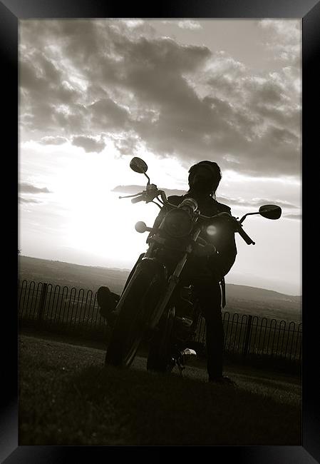 biker at sun set Framed Print by tom crockford