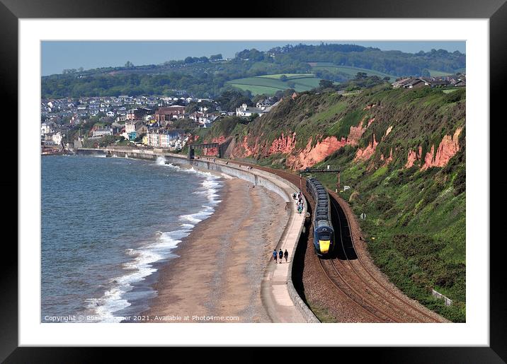 GWR train leaving Dawlish in South Devon  Framed Mounted Print by Rosie Spooner