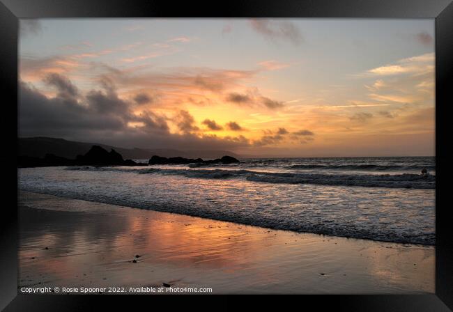 Moody sunrise at Looe Beach Framed Print by Rosie Spooner