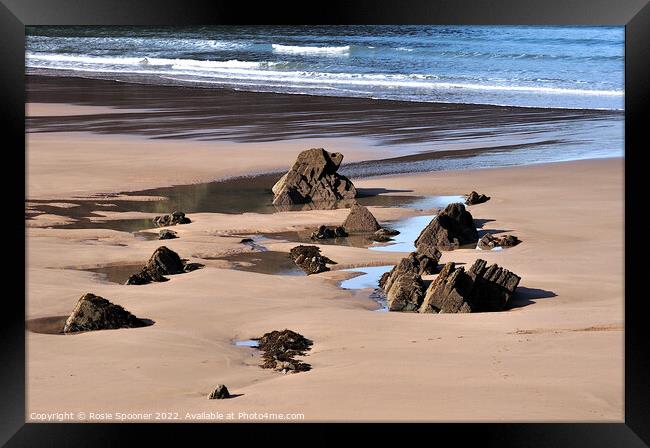 Puddles and Rocks at Putsborough Sands Framed Print by Rosie Spooner
