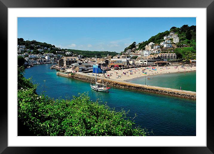 A boat head back up the River Looe in Cornwall Framed Mounted Print by Rosie Spooner
