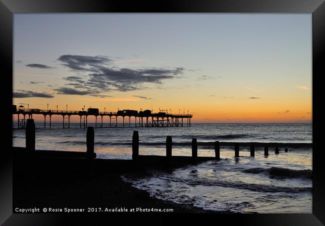 Silhouetted sunrise  of Teignmouth Pier and Groyne Framed Print by Rosie Spooner