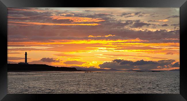 Late evening sunset at Lossiemouth lighthouse Framed Print by Lloyd Fudge