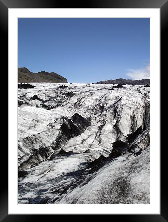 Volcanic ash on glacier. Framed Mounted Print by Kay Gorzko