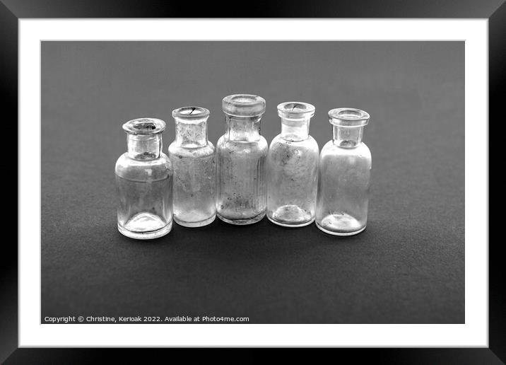 Tiny Glass Bottles Framed Mounted Print by Christine Kerioak