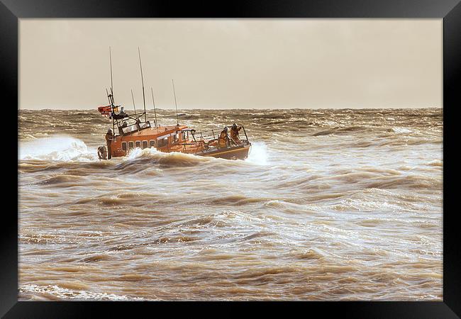 Lifeboat half hidden in the trough Framed Print by Christine Kerioak