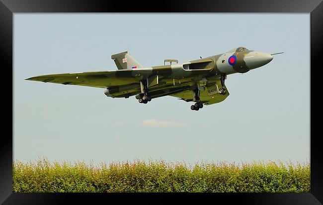 Vulcan over the hedge Framed Print by Andrew Steer
