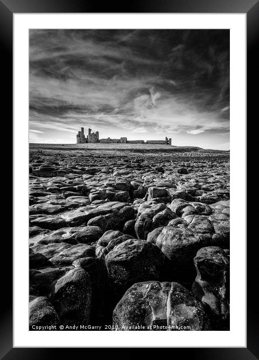 Dunstanburgh Castle at low tide Framed Mounted Print by Andy McGarry