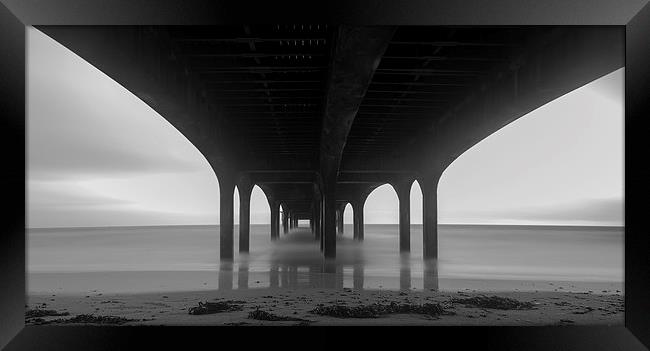 Tranquil seascape under Bournemouth Pier Framed Print by Daniel Rose