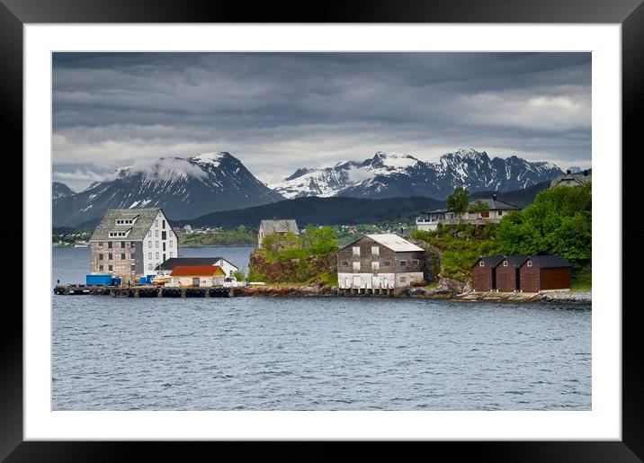 Wooden Buildings and Mountains in Alesund Norway Framed Mounted Print by Martyn Arnold