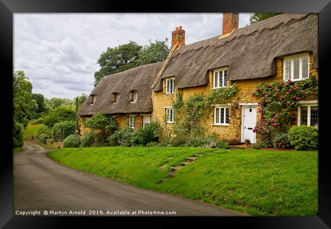 Thatched Cottages Wadenhoe Village Northants Framed Print by Martyn Arnold