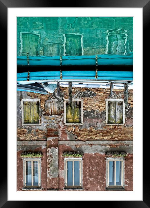 Reflection of Venetian house and boat on a canal Framed Mounted Print by Jean Gill