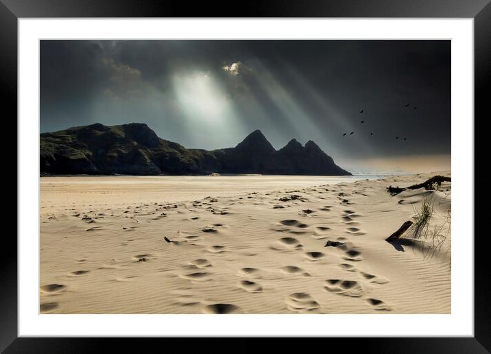 Shafts of light over Three Cliffs Bay Framed Mounted Print by Leighton Collins