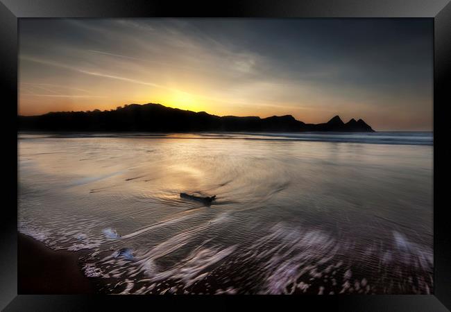 Outgoing sea at Three Cliffs bay Framed Print by Leighton Collins