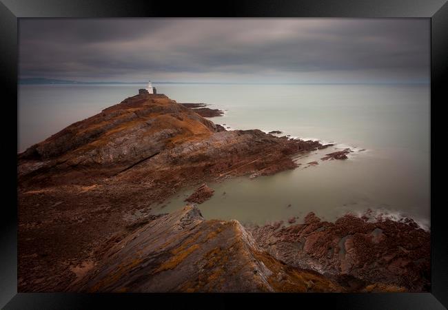 Calm seas at Mumbles lighthouse Framed Print by Leighton Collins
