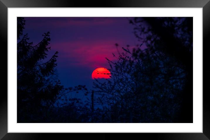 A big red setting sun Framed Mounted Print by Leighton Collins