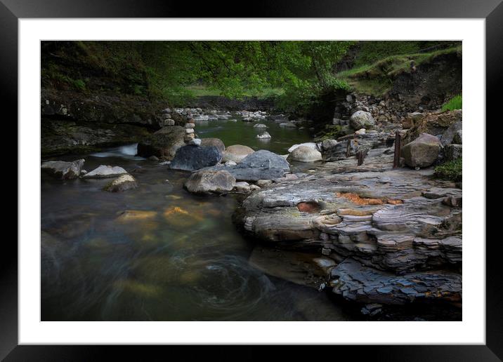 Small stone stacks on the Afon Twrch Framed Mounted Print by Leighton Collins