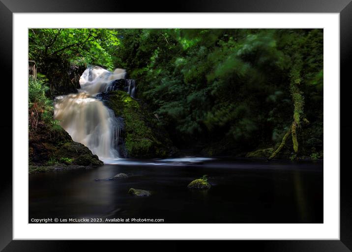 A waterfall in a valley on a windy day Framed Mounted Print by Les McLuckie