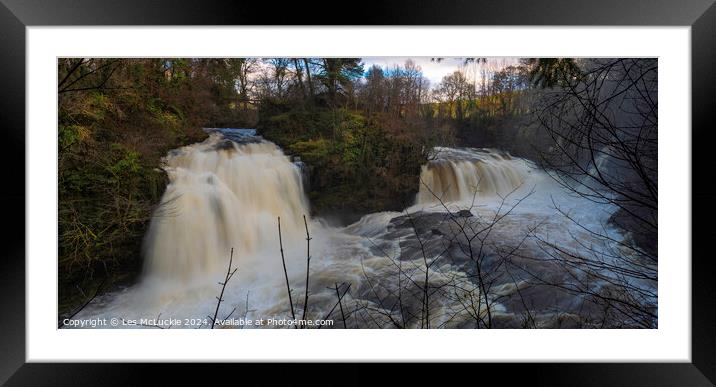 A waterfall surrounded by snow Framed Mounted Print by Les McLuckie