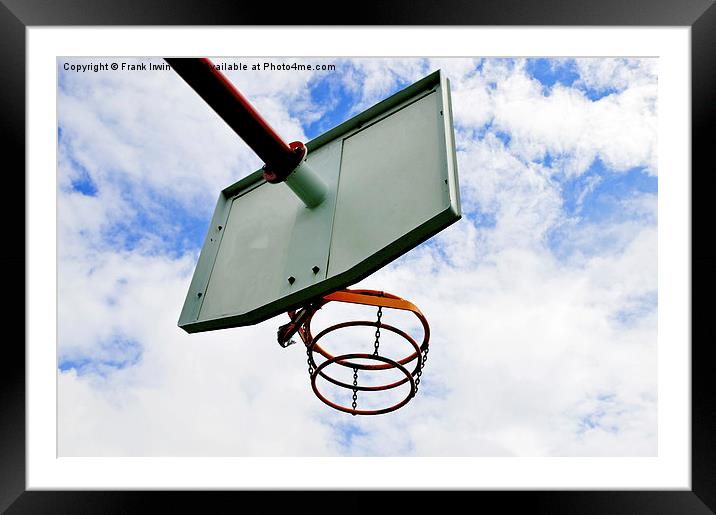 A basketball hoop against a blue sky Framed Mounted Print by Frank Irwin