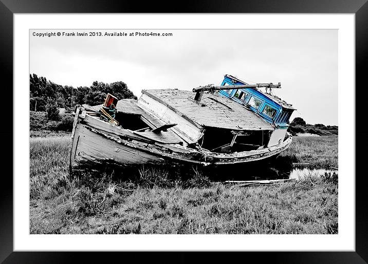 An abandoned and worse for wear boat Framed Mounted Print by Frank Irwin
