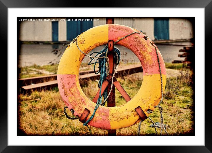 Old and redundant dockside life belt Framed Mounted Print by Frank Irwin