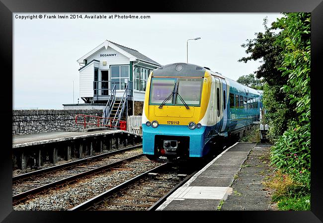 An Arriva train arriving at Deganwy Station Framed Print by Frank Irwin