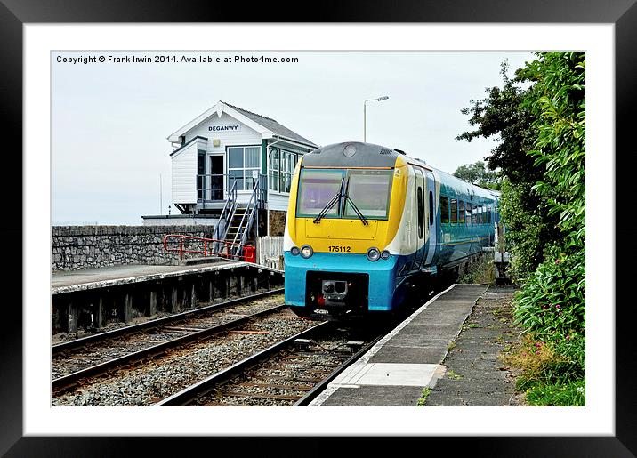 An Arriva train arriving at Deganwy Station Framed Mounted Print by Frank Irwin