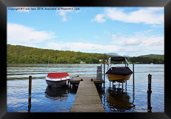 Two boats tied to the mooring posts on a pier Framed Print by Frank Irwin