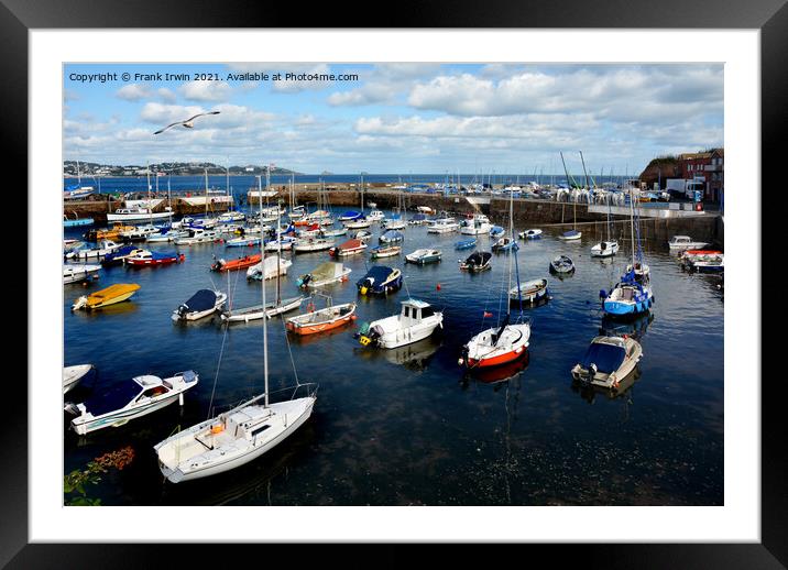 Small boats lie at anchor waiting for the weekend  Framed Mounted Print by Frank Irwin