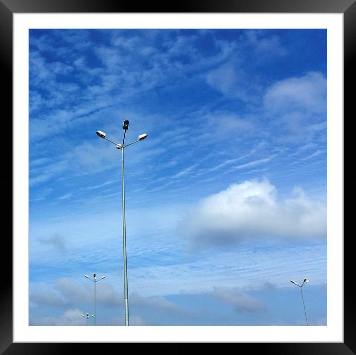 lamps under blue sky Framed Mounted Print by Marinela Feier