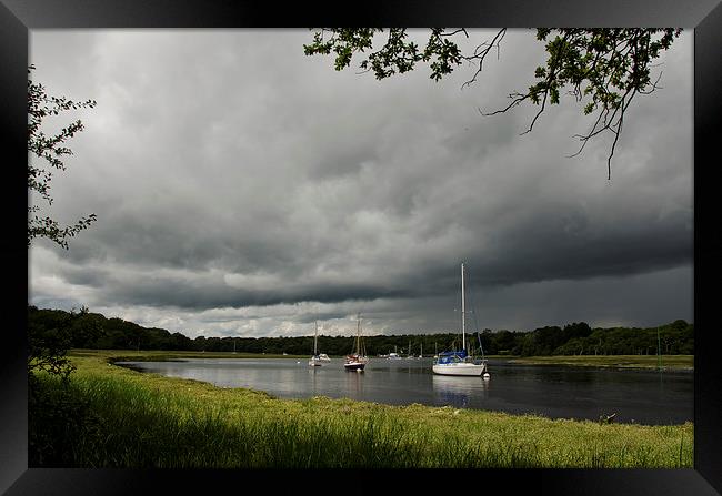Stormy skys over Beaulieu river Framed Print by Dan Ward