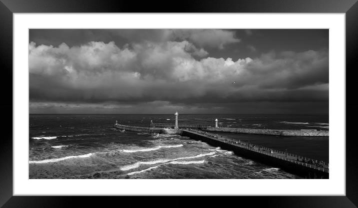 Stormy Skies over Whitby Pier  Framed Mounted Print by Dan Ward